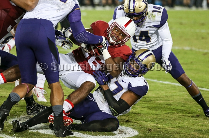 2015StanWash-054.JPG - Oct 24, 2015; Stanford, CA, USA; Stanford Cardinal running back Barry Sanders (26) runs for 4 yards in the second quarter before being tackled by Washington Huskies linebacker Scott Lawyer (47) at Stanford Stadium. Stanford beat Washington 31-14.
